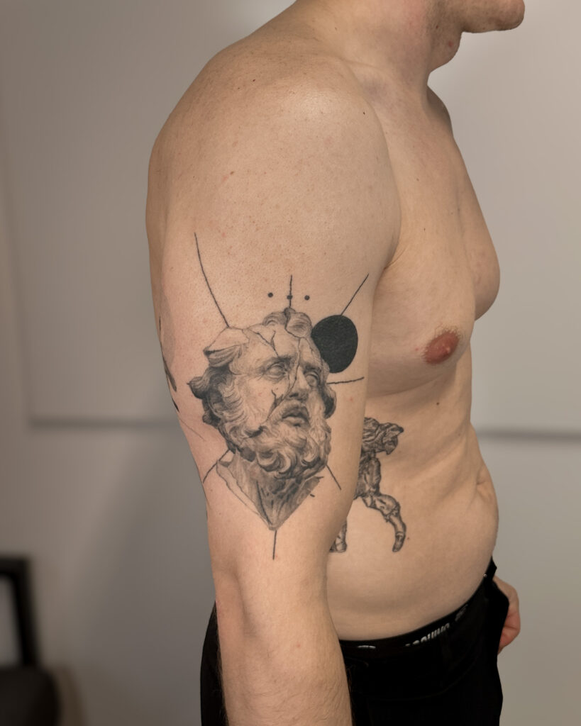 2+ years healed tattoo - Fragmented Classical Portrait - Upper arm - Vytautas Tattoo