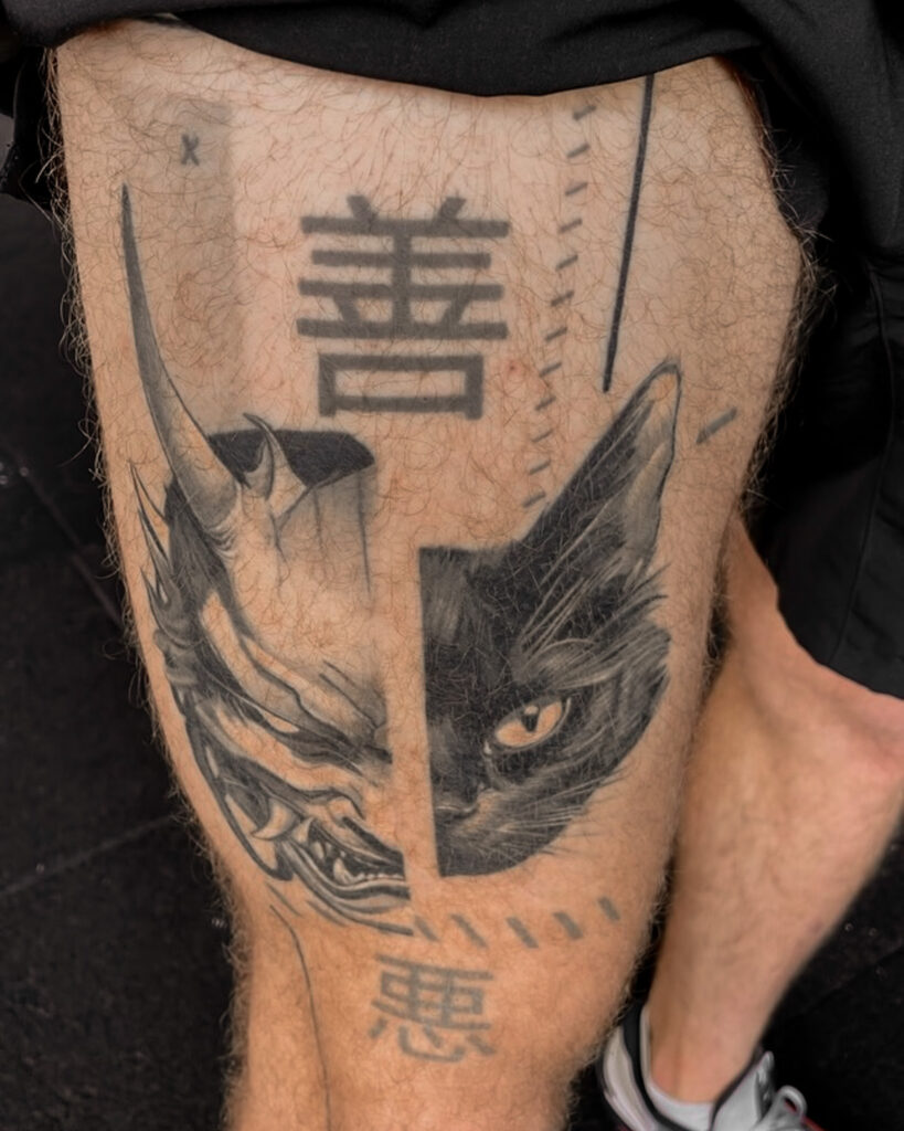 4 months healed tattoo - Oni and Cat Split Portrait - Leg - Vytautas Tattoo